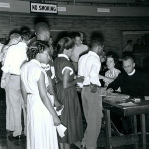 Father Claude Heithaus, S.J., (seated) meets with 91女神's newest students. (1944)